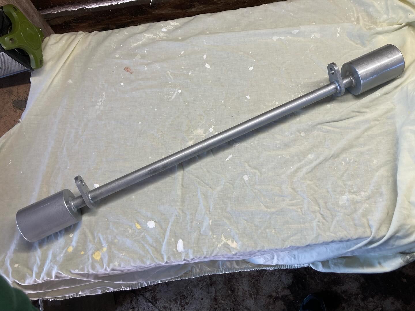 Weighted bar for swinging trapeze